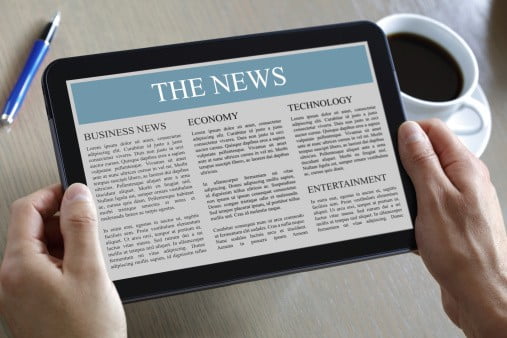 newspaper on tablet